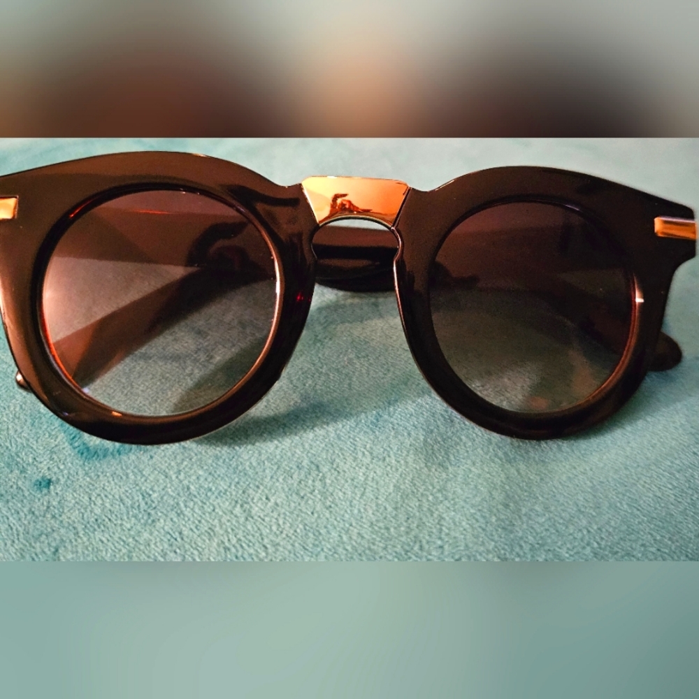 Black sunglasses with gold accent